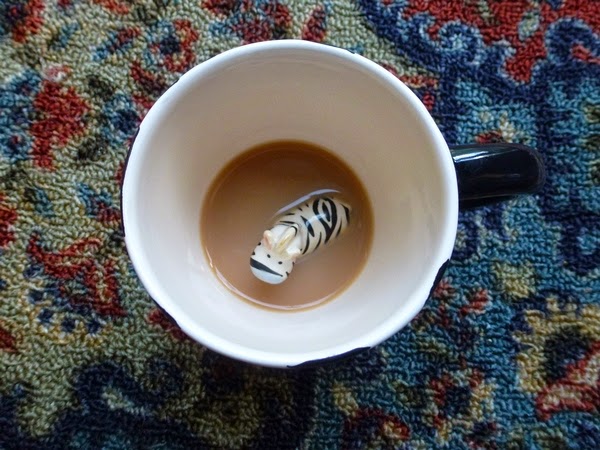 drowning zebra at the bottom of a cup